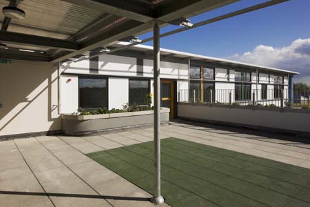 Sillogue Nursery-exterior concrete conopy roof garden flag stones playground
