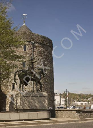 Royalty free stock image of Waterford Ireland- Urban seating Thomas Francis Meagher sculpture Reginalds stone tower 