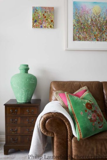 Living room details artwork cushions vase