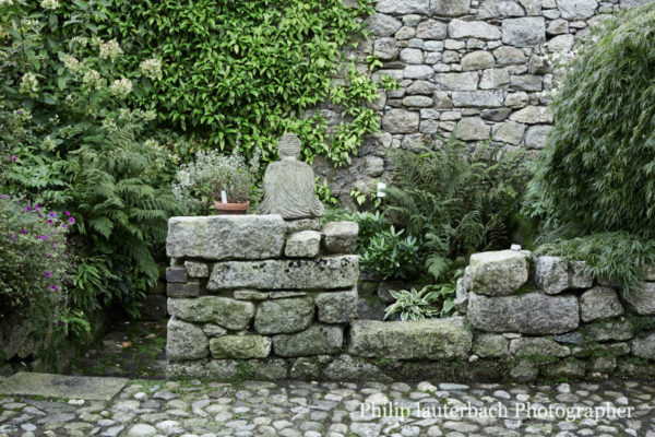 Garden patio detail cobble stone wall statue