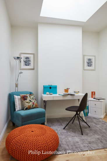 Home office shylight desk floor lamp chair rug artwork storage